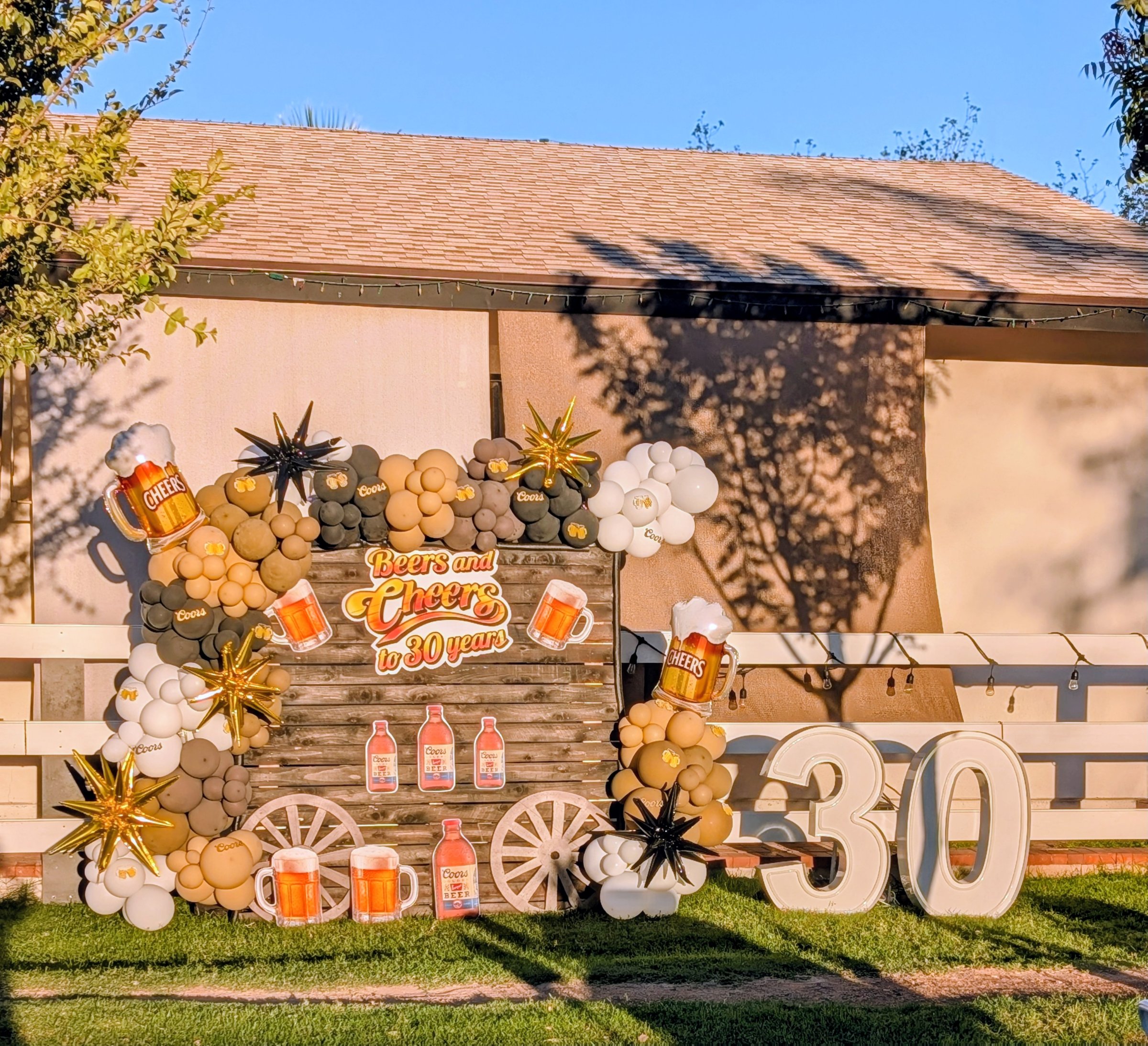 rustic fence backdrop with custom graphics + LED marquees
